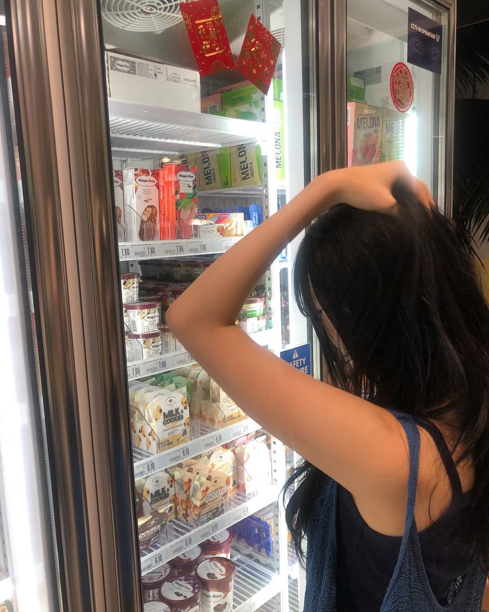 jiaheon's tweet photo. Gazing thoughtfully at the frozen treats behind the glass door, the soft light highlights her anticipation as she decides what to pick. https://t.co/jogOeh4jHc