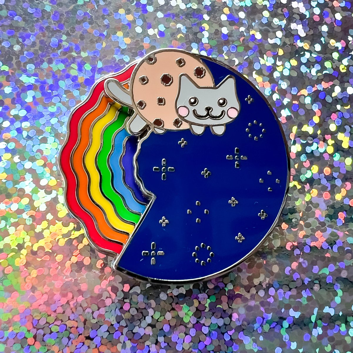 NyanCat's tweet photo. Shoutout to @cookie_brigade for crushing it at Pax East. Happy to hear that Nyan Cat pins played a part in helping raise raise over $8,000 for charity 🐈‍⬛✨ https://t.co/UPRsvv0ndE