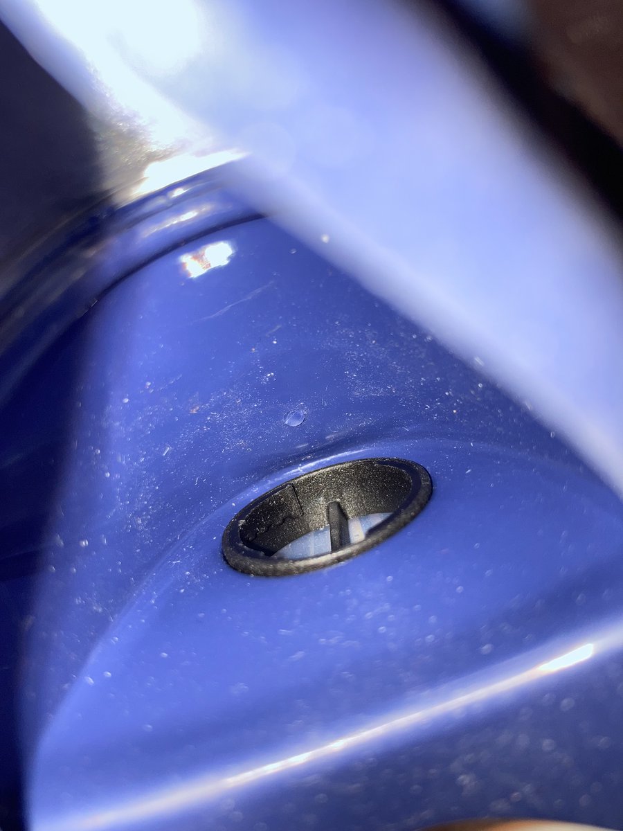 That did the trick, and I was able to push the valve cage through until it was flush with the mask in front, and cleared the inner snorkel material inside.