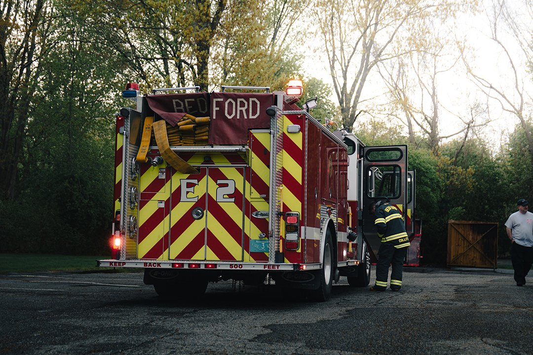 Firefighters in Bedford take up after a fully involved dumpster fire last week.