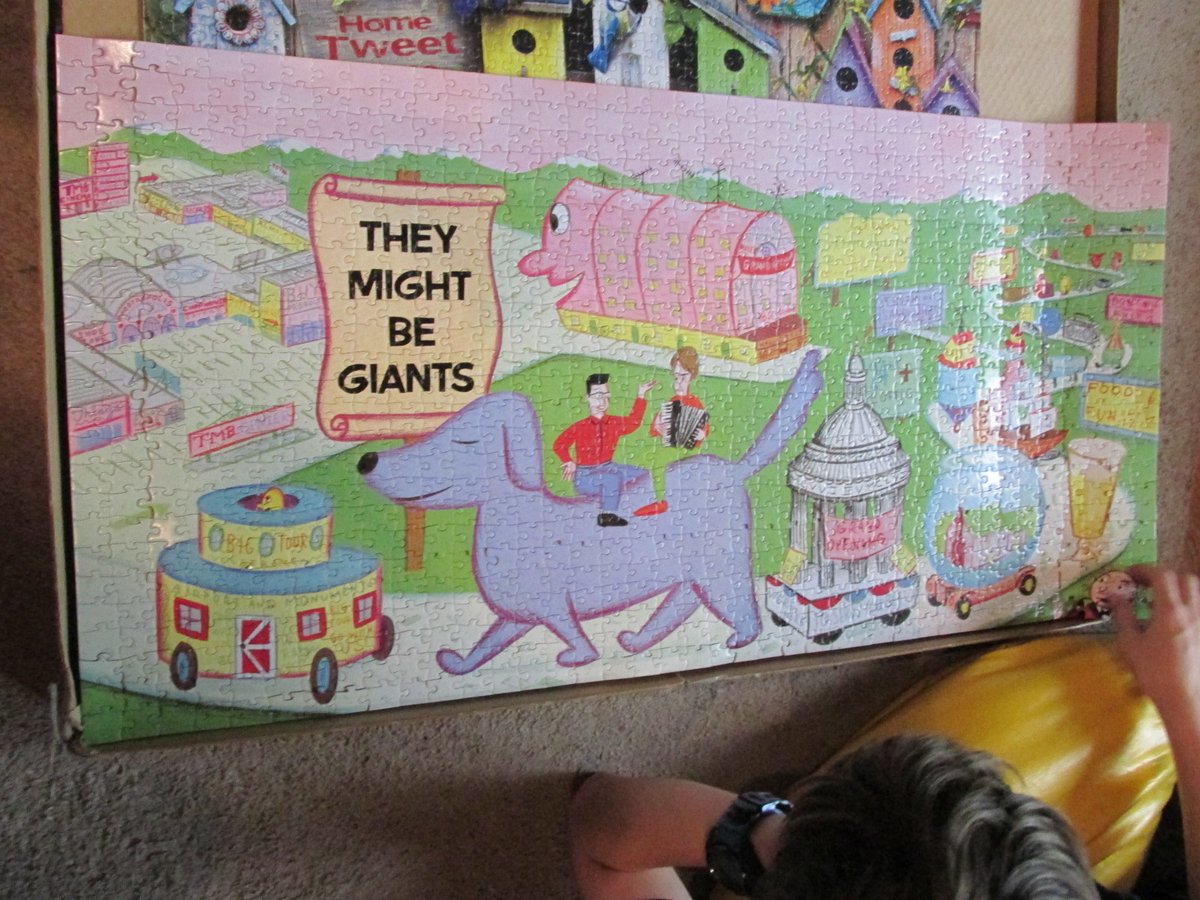 finally finished the <a href="/tmbg/">They Might Be Giants</a> pink album puzzle which was slightly too wide for the puzzle board

now playing the pink album to the family in a vain attempt to explain toddler highway to them