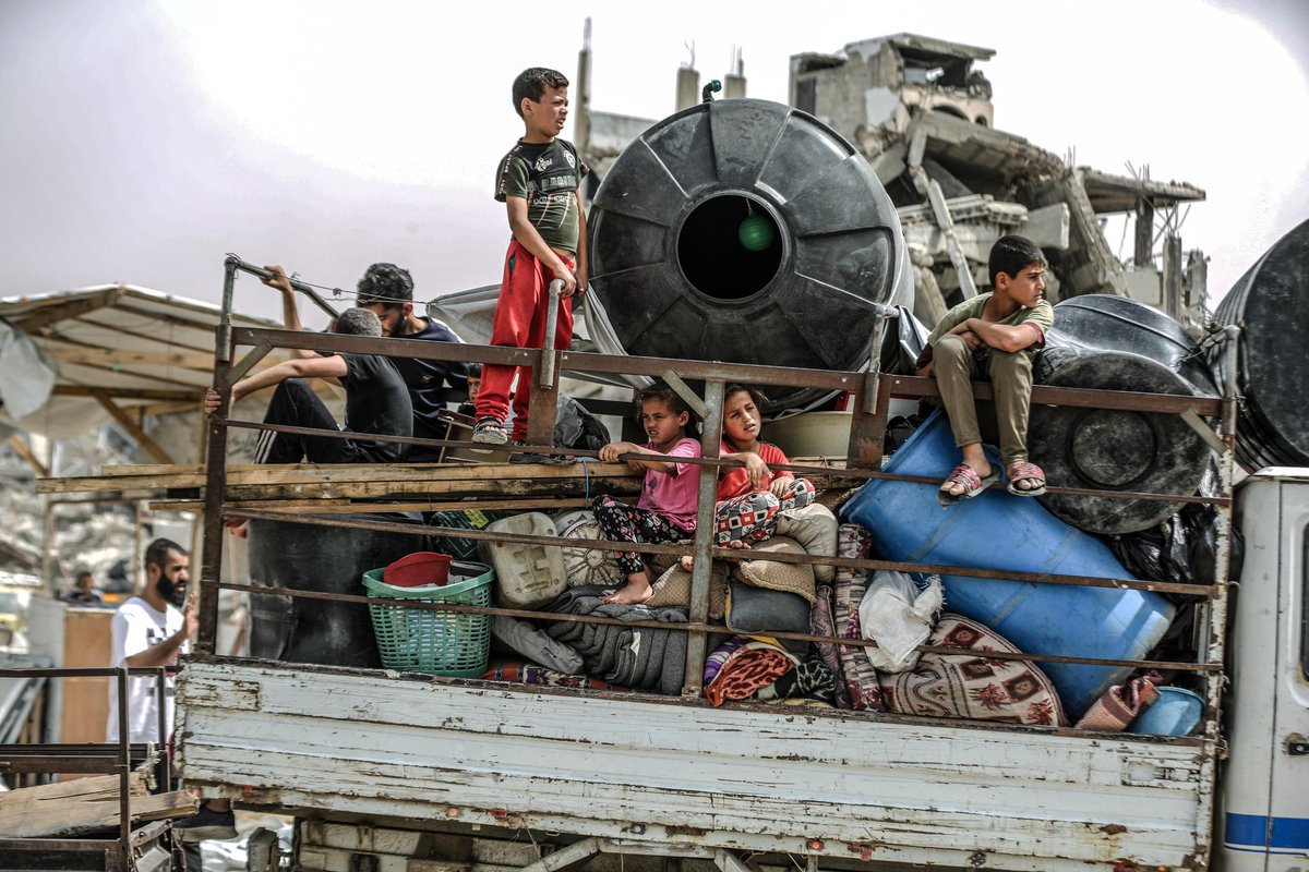 Palestinians flee with their belongings to the safe areas after Israeli airstrikes in Gaza City, Gaza on May 17, 2025. (Photo by Ali Jadallah/Anadolu via Getty Images)