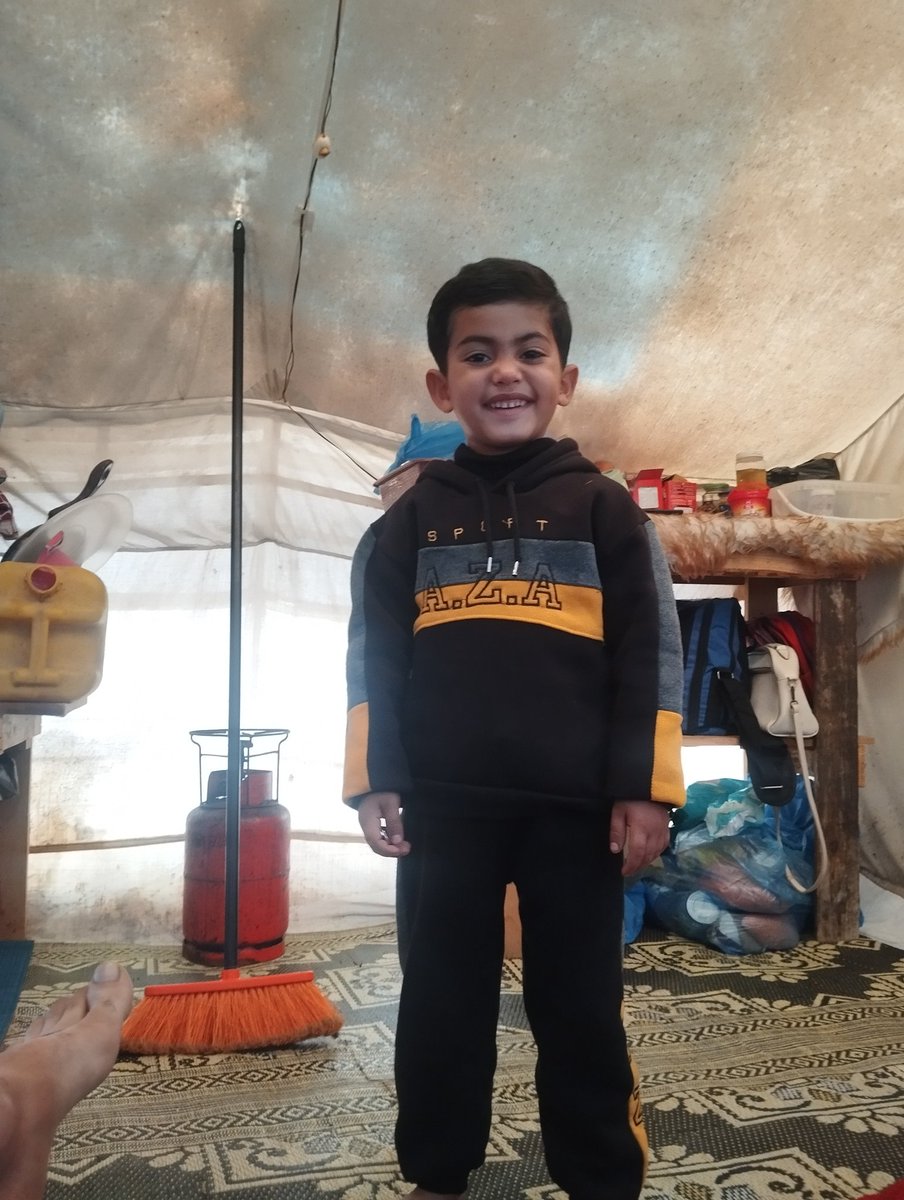 Today, during yet another heartbreaking journey of displacement, we were forced to flee again. I had recently rented a small apartment just to find some relief from the pain and misery of the tent — but today, that shelter was taken from us too.
As we packed in haste, my little