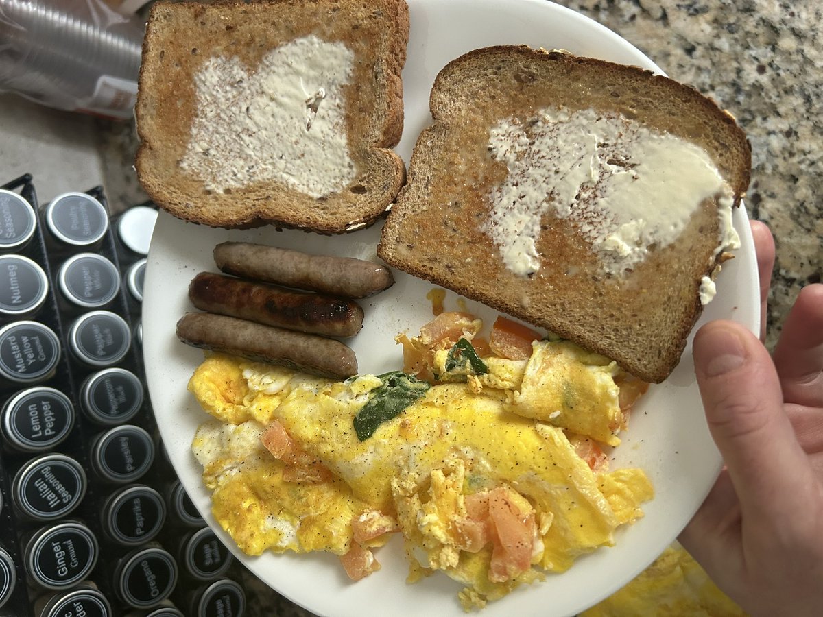 JreSeawolf's tweet photo. So on weekends I always try and make everyone a nice breakfast. (See picture with the eggs and sausage.) My twins often ask me to make “dippy eggs”, over easy inside bread. I usually have a little circular cutter for the task but couldn’t find it today, so…. 😆

#CookingWithJRE https://t.co/YyWqoPqwfX