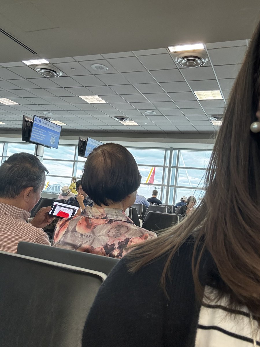 This cute couple behind me at the airport is watching a replay of the Sky/Fever game from earlier today. Everybody watches women’s sports!