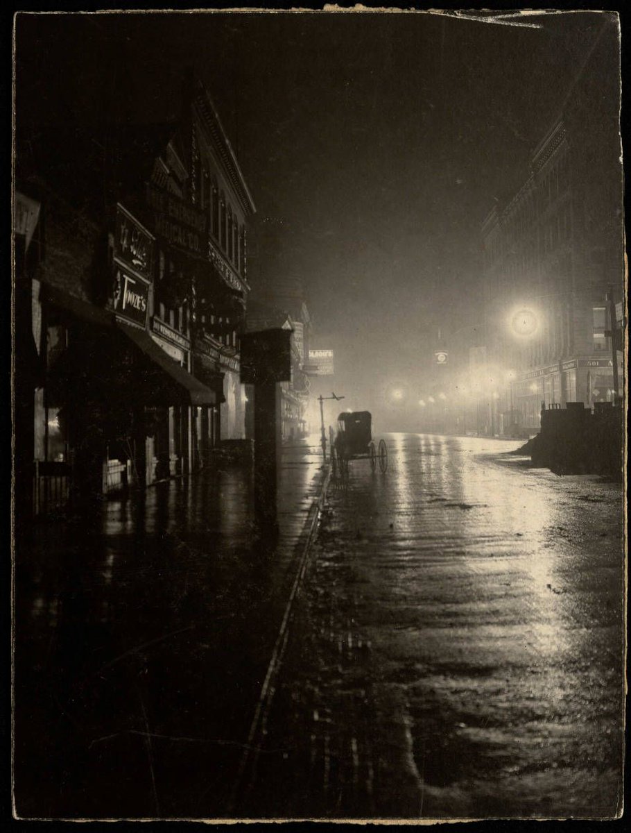 Rainy night on Hennepin Avenue in the 1900s.