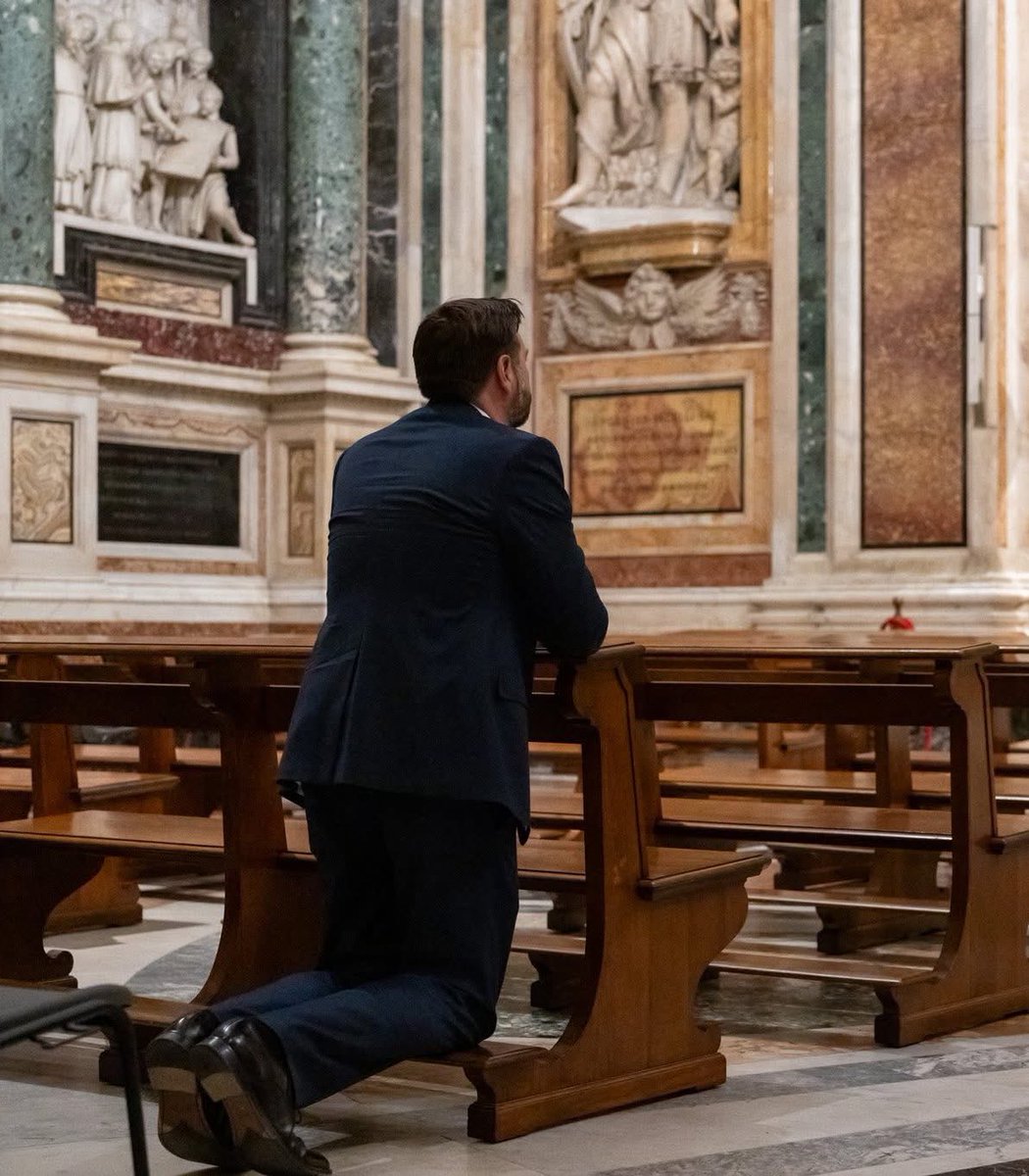 Sachinettiyil's tweet photo. U.S. Vice President J.D. Vance, a Catholic convert, is seen kneeling in prayer at the Vatican. He is currently in Italy with his wife, Usha, to attend the inauguration of Pope Leo XIV, scheduled for tomorrow.

Image: JD Vance https://t.co/XnjMGGJW9P