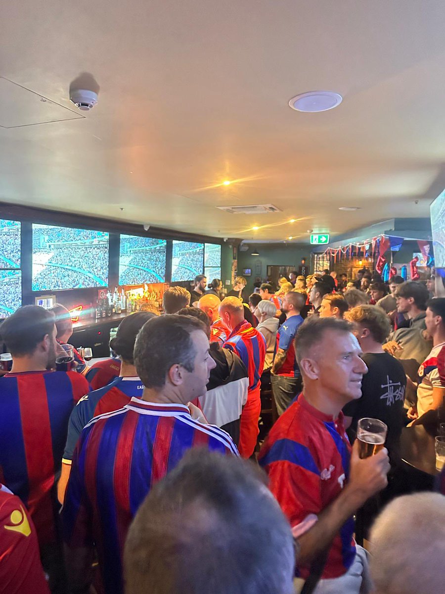 RossiParish01's tweet photo. Wasn’t at Wembley, but had the next best thing with the Palace boys in Sydney 🇦🇺🔴🔵  

Packed pub, limbs everywhere, emotional rollercoaster. 🏆

Henderson. Eze. Sarr. Mateta. Heroes. 🦅🏆🔥 #CPFC https://t.co/8bm5w5QiGY