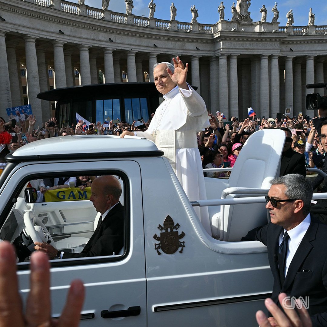 CNN's tweet image. Pope Leo greets crowds from popemobile as inaugural Mass begins at the Vatican cnn.it/4kvkPAd