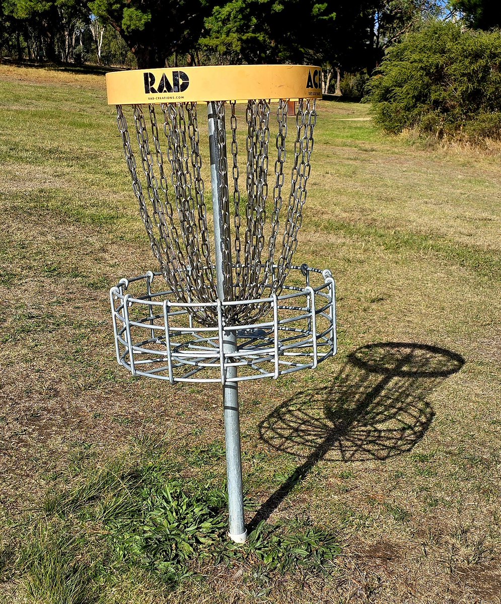 'Frisbee golf' is (apparently) like real golf, with 18 holes of varying lengths. You need Frisbees of different sizes &amp; weights, with the smallest/heaviest dopping into the basket shown when it hits the chains above.