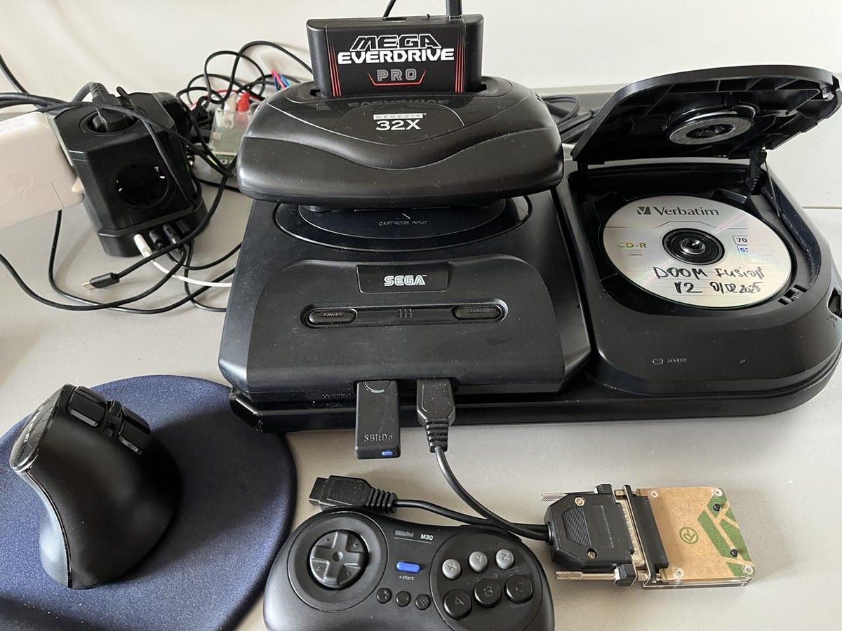 vluchitz's tweet image. The setup that #Doom #32X Resurrection and CD32X Fusion were developed on. The extra hardware list on the pic: MedPro, HD MonsterVision cables, RetroTink 2x, BlueRetro mouse adapter, 8bitDo M30. Not in the pic - Sega MegaMouse, mostly retired.