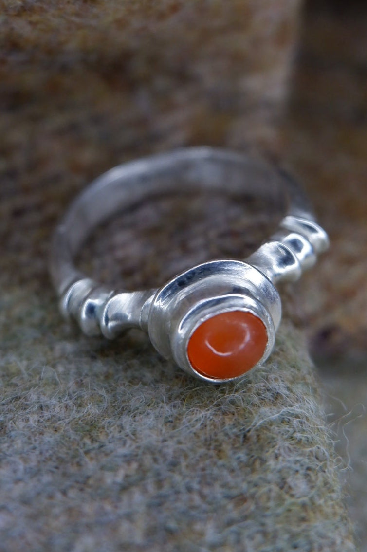 caledonianforge's tweet image. Another from "Ancient Rings of Scotland". One of the silver Roman Rings from Culbin Sands, Moray. The original artefact has an empty stone setting but I figured a carnelian cabochon would be a good replacement.