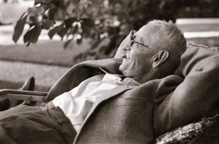 Hermann Hesse relaxing at the Schloss Bremgarten near Bern, Switzerland.