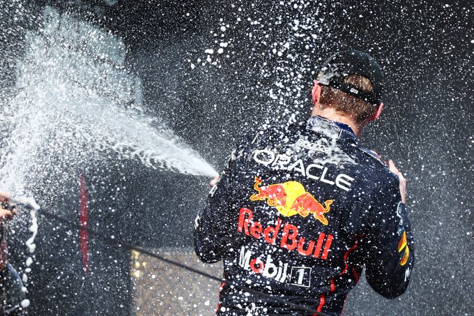 Max, sprays champagne on the podium.