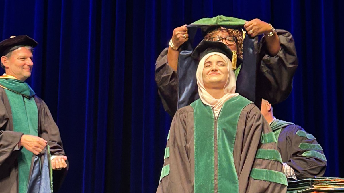 MedicineUVA's tweet photo. They did it! MD graduates officially hooded and celebrated at the historic @cvilleparamount #UVA2025 https://t.co/AHlU5mE53j