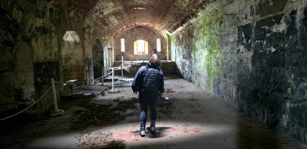 I captured this cellphone picture during my photography business' 79th photo workshop yesterday at Historic Fort Adams in Newport, RI. One of my guests stands illuminated under a smoke vent behind the forts' bakery.

Fort Adams was constructed between 1824 and 1857. Named after