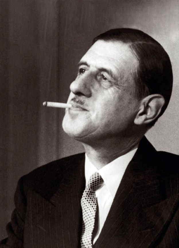 Charles De Gaulle taking a thoughtful drag on his Gauloise.