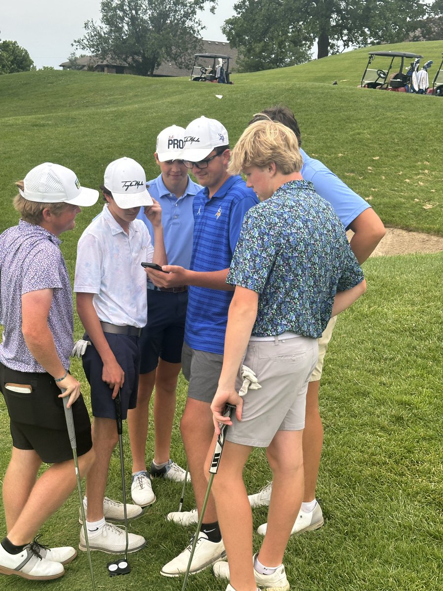 The guys checking out <a href="/aLongShot/">Adam Long</a>’s video during the practice round today.