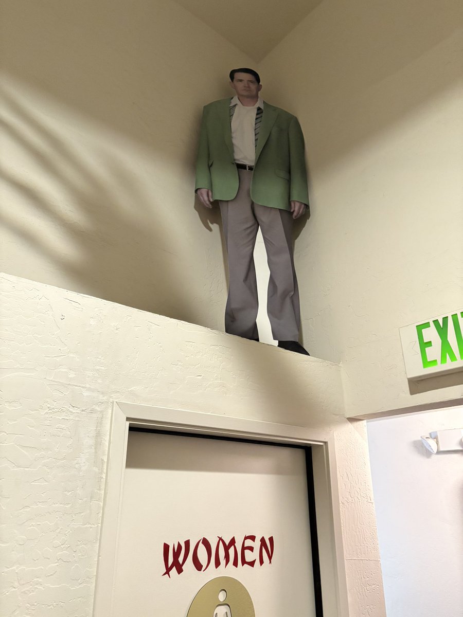 apple_coring's tweet image. my favorite movie theater has this cutout of dougie that guards women when they go to pee