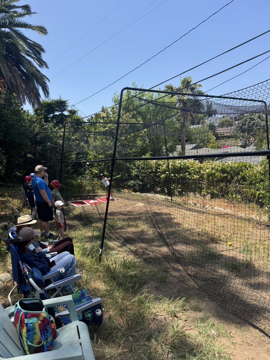 Reina89's tweet photo. Coach told us he made a batting cage in his backyard and this was what it was…wow. https://t.co/3ZhDsHEFSa