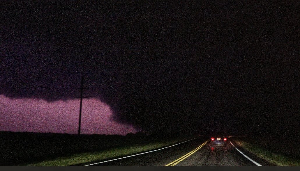 Jesse_Risley's tweet photo. The large #tornado that went just south of Greensburg, KS a few hours ago illuminated itself as it took out power poles on US 183 south of Greensburg. #kswx  @NWSDodgeCity #TornadoEmergency https://t.co/5SJER7snI7