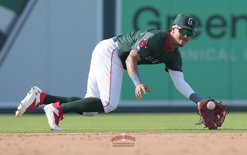 Shortstop Nazzan Zanetello (2) of the Greenville Drive lunges for a grounder in a game against the Hub City Spartanburgers on Sunday, May 18, 2025, at Fluor Field at the West End in Greenville, South Carolina. (Tom Priddy/Four Seam Images)