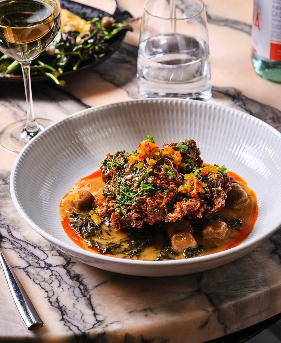Fried chicken, but make it fancy...the Sugar Hill Nights is fried chicken with almond dumpling, braised kale, and chicken jus. Enjoy this elevated classic only at #metropolisbymarcus!