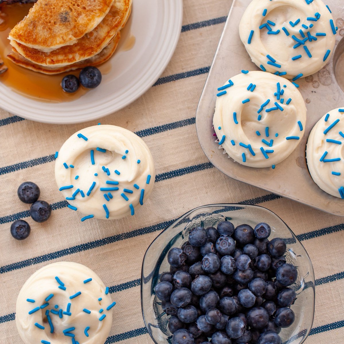 Now baking: Blueberry Pancake Cupcakes 🫐🥞 A vanilla cupcake bursting with fresh blueberries, topped with maple buttercream. Like your favorite brunch, but sweeter.⁠