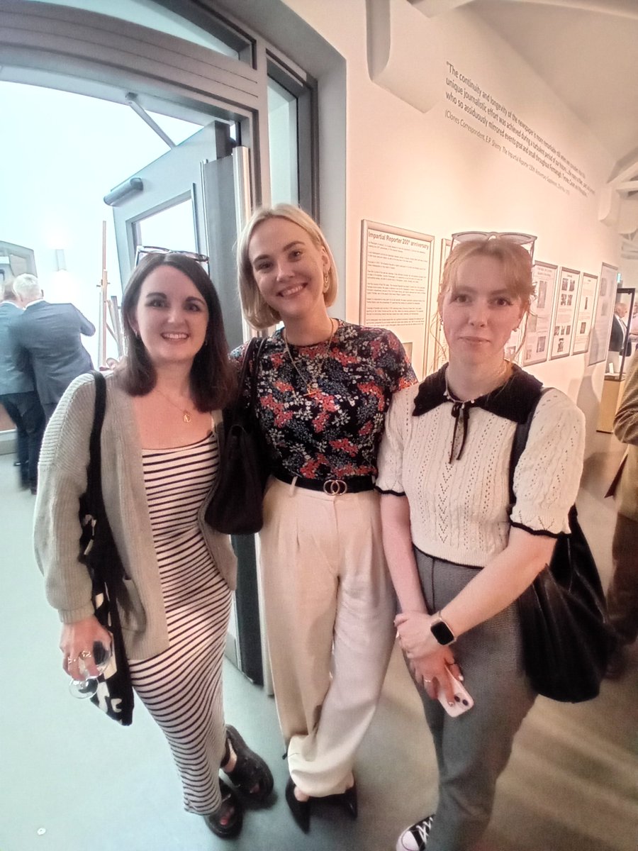 Staff members Victoria Johnston and Jasmin Walls enjoy the exhibition alongside former Reporter, Jessica Campbell.