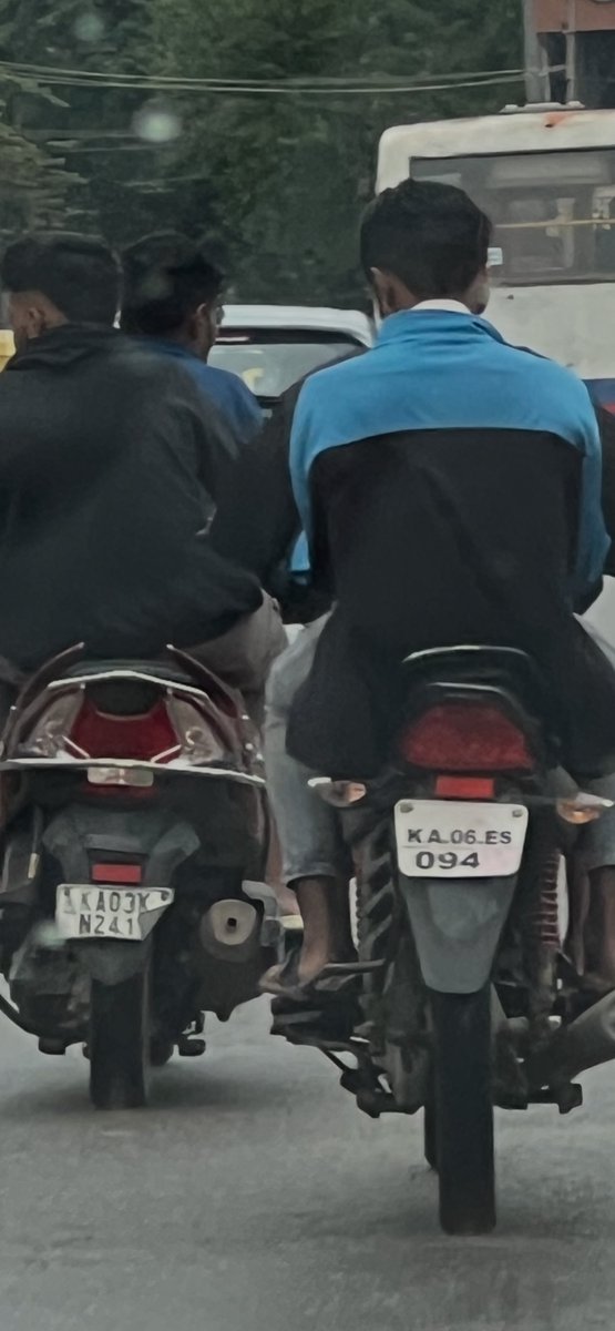 egunda's tweet photo. This duo seen at hennur road at 7.26am on 20th may 2025. They have purposefully hidden their last digit in number plate with tape and folding rhe plate. Stolen vehicles? @btppubliceye @hulimavutrfps @blrcitytraffic https://t.co/tugiYjlgcv
