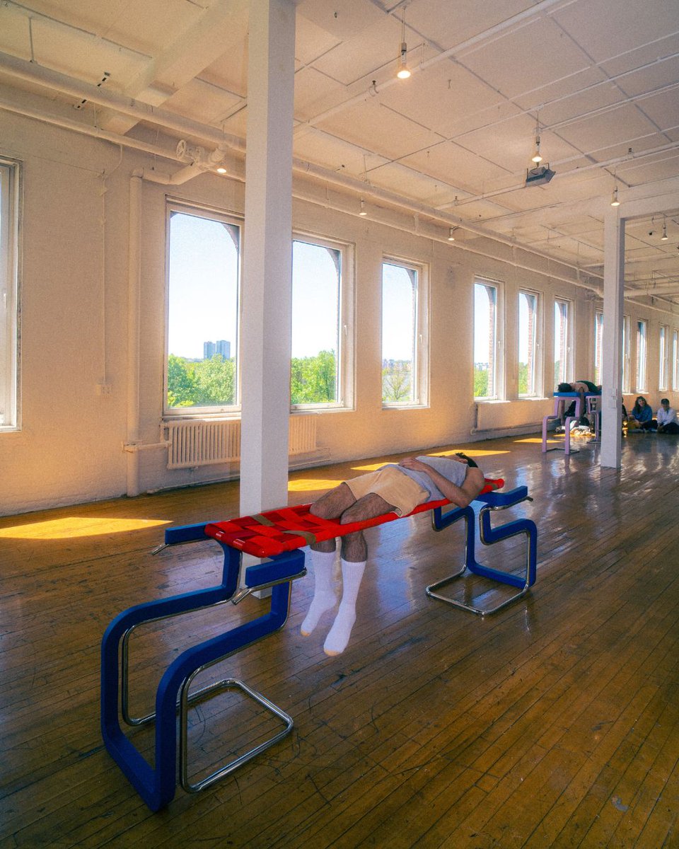 Throughout the airy loft space, five pairs of steel sculptures—mutated descendants of chrome cantilever chairs—stand like minimalist relics of a future past. At first glance, they feel almost cold, industrial.