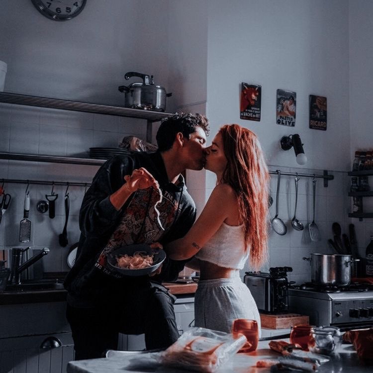 "Always have to kiss the cook"

She kisses him softly