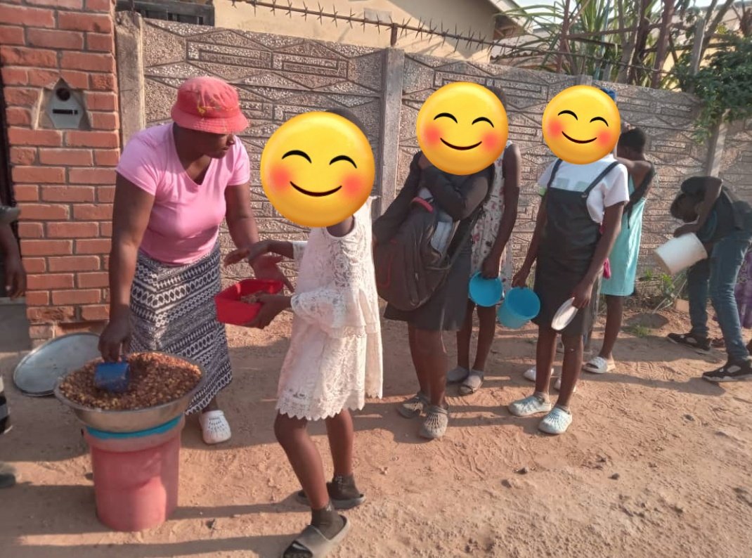 On this day we served Mutakura. A mixture of dried maize grain and beans (nyemba). This too, is a hit with the children at all kitchens.