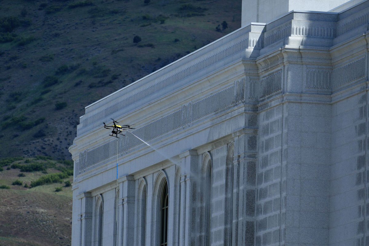 A cleaning drone was used today to power wash the exterior granite of the Lindon Utah Temple. The craft was attached to a water source and launched into the air before the spraying mechanism was activated. The cornerstone has been installed, inscribed with the words: Erected