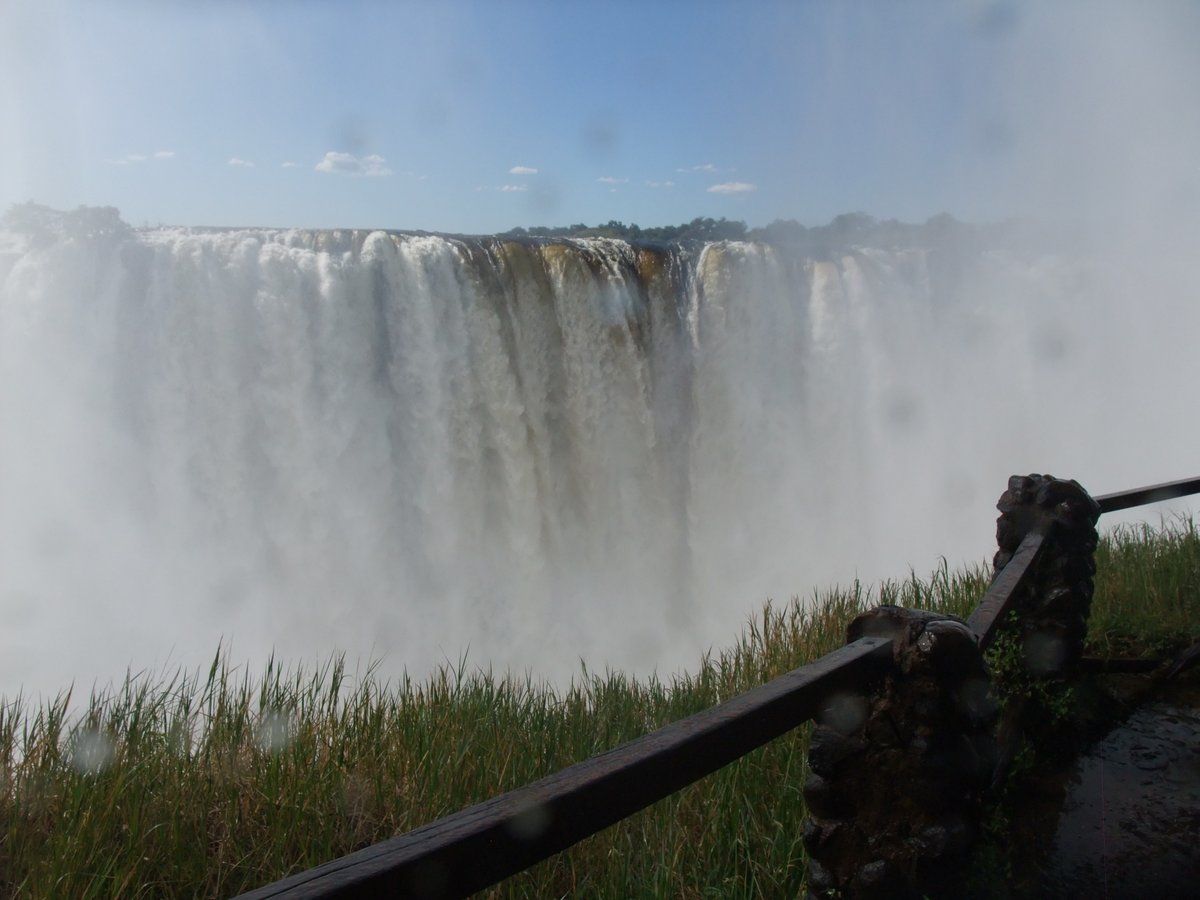 Wet walking!
We didn't bother with raincoats and stuff for our 2nd walk ... we experienced the spray like the locals do. Such fun.
Victoria Falls, Zambia, May 2025.
Photograph by Raymond Travers
