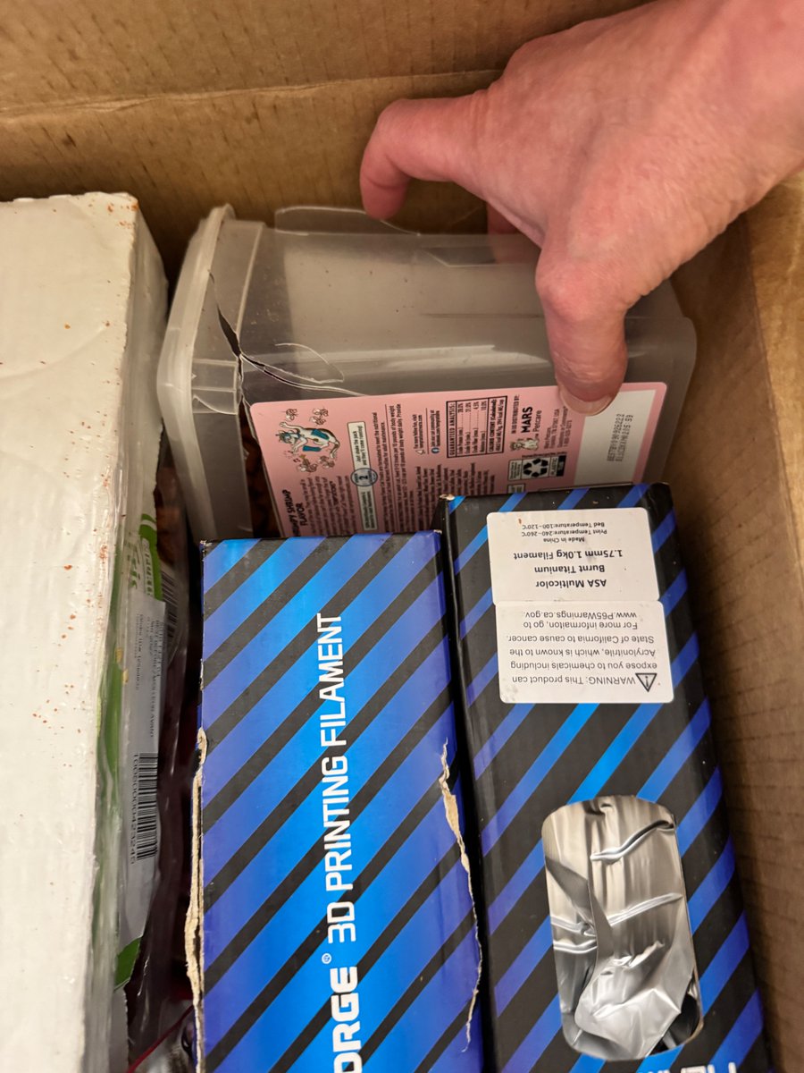 dachilders's tweet photo. @AmazonHelp 2 orders in a row now some absolute dumbass thought it would be a good idea to put a flimsy plastic container of cat treats in the same box as multiple cases of canned cat food. Now I'm not sure who's stupider, you or me. You keep doing this, but I keep paying for it. https://t.co/fBcAoQhhM5