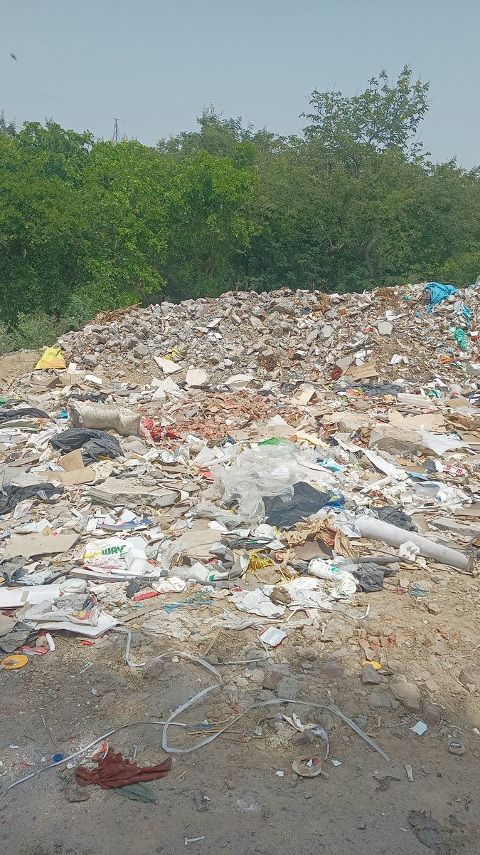 <a href="/OfficialGNIDA/">Greater Noida Industrial Development Authority</a>, <a href="/dmgbnagar/">DM NOIDA Gautam Buddha Nagar</a> , please see green belt  is turning in the garbage Dumping ground.