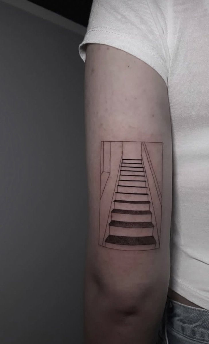 ltoms91's tweet photo. To most people, it looks like just a staircase. 
Simple lines, black and white. But I know what it really is. This is a very specific place. A frozen moment in time. It’s where I first met five boys who didn’t know the world yet, but were already building mine. Sitting on those- https://t.co/NuDESwI12c