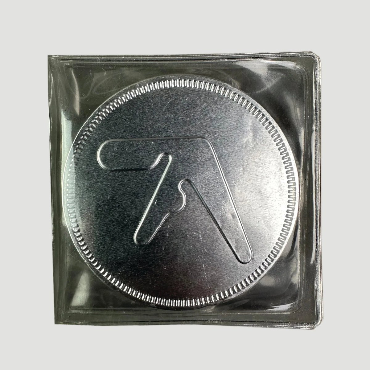 3CC0__'s tweet photo. Aphex Twin promotional Chocolate coins to promote the 2002 compilation 26 Mixes for Cash https://t.co/OHfum4ey2j