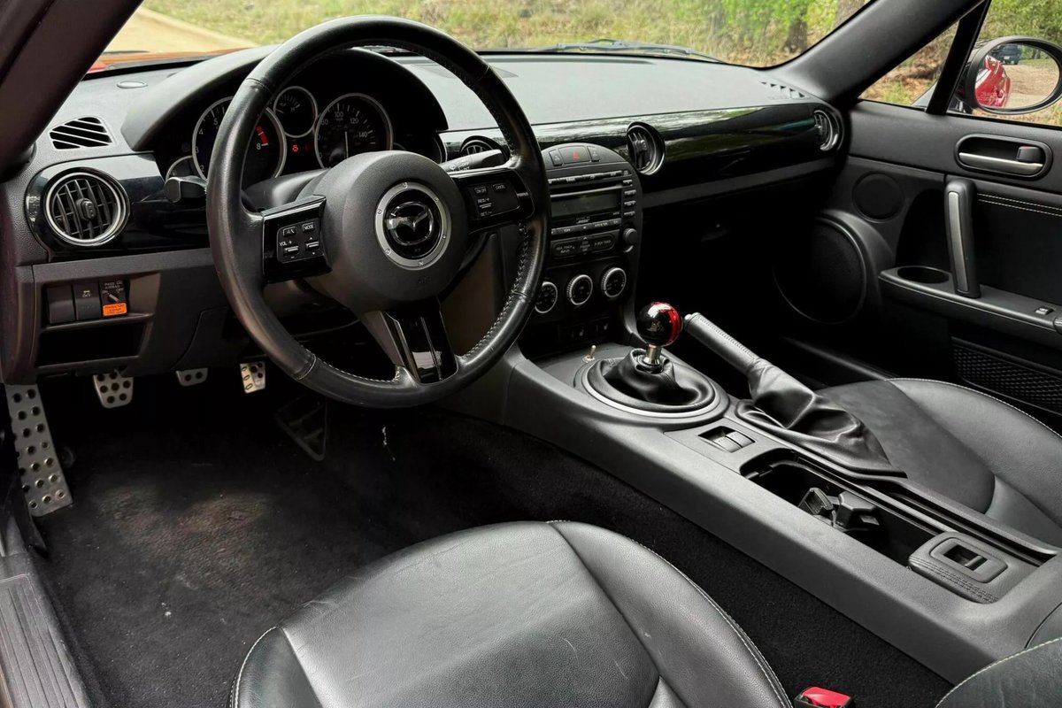 2012 Mazda MX-5 Miata Special Edition (auction)

current bid $12,500

GM 5.3L V8 engine
6-speed manual
limited-slip rear differential

Velocity Red paint
heated seats
leather upholstery
Bose sound system
power-retractable hardtop