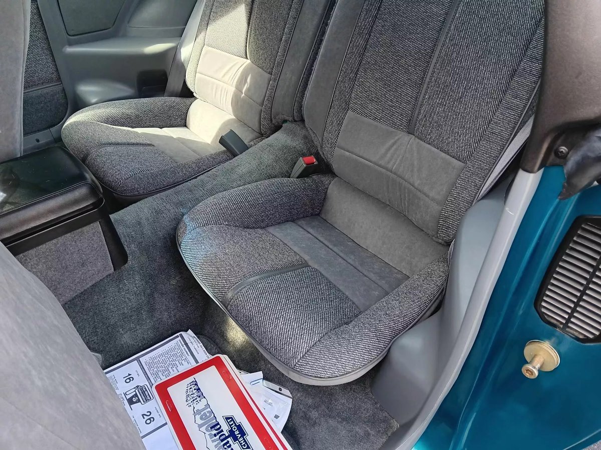 1992 Chevrolet Camaro Z28 1LE (auction)

original 5L ICE V8, 230 hp
5-speed manual, RWD
0-60 mph in 8.1s

drove only 1,324 miles (2,130 km)

original plastic still covering the seats and floor mats