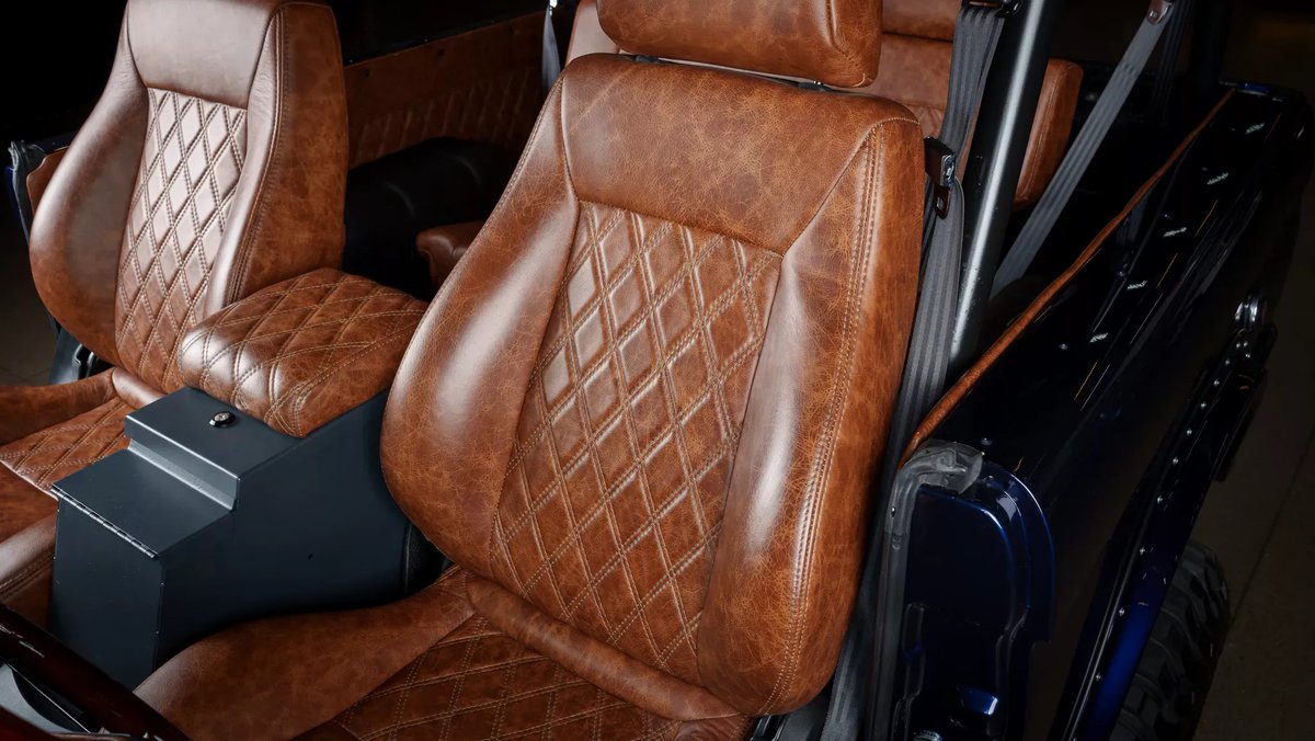 1975 Ford Bronco (restomod)

5L Coyote V8
10-speed auto

repainted in deep metallic blue

mechanical and interior changes

glass replaced
new chrome front, rear bumpers
modern LED headlights
roll cage

hardtop and black soft top