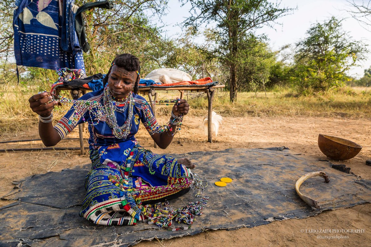 Tariq Zaidi (@tariqzaidiphoto) on Twitter photo Wodaabe women take pride in their appearance. This woman untangles her plastic beads in preparation for the Gerewol festival. Image by <a href="/tariqzaidiphoto/">Tariq Zaidi</a> 2016. #Chad #Gerewol #Wodaabe #CulturalTraditions Wodaabe women take pride in their appearance. This woman untangles her plastic beads in preparation for the Gerewol festival. Image by <a href="/tariqzaidiphoto/">Tariq Zaidi</a> 2016. #Chad #Gerewol #Wodaabe #CulturalTraditions
