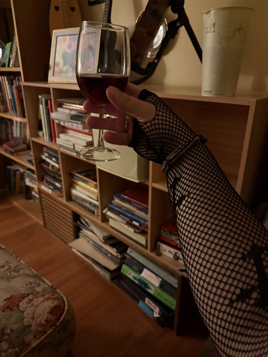 I went full on goth last night without even realizing it. I had on my black label Batman-Damned t shirt, my order of the Dracul ring and cross inlayed fishnet arm warmers while sipping a glass of red wine while watching Rukis was drawing a new daki.