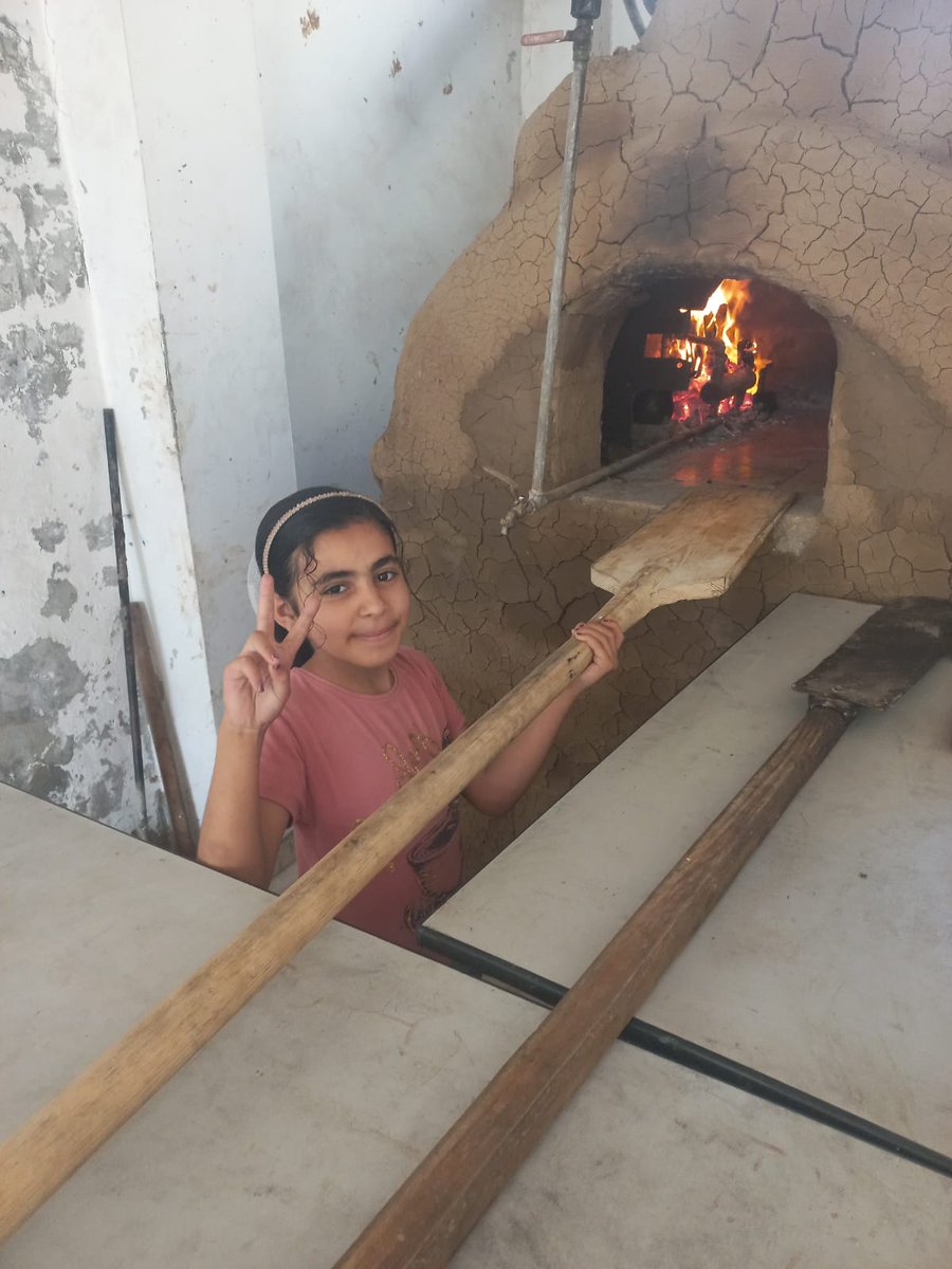 Below are pictures of SalahDean who built an oven from clay &amp; his daughter beside the working oven. In Gaza, they grind pasta and knead it like flour to make the food go further. SalahD feeds many, if you can support him to make food, his page is here: gofund.me/63fe04e2