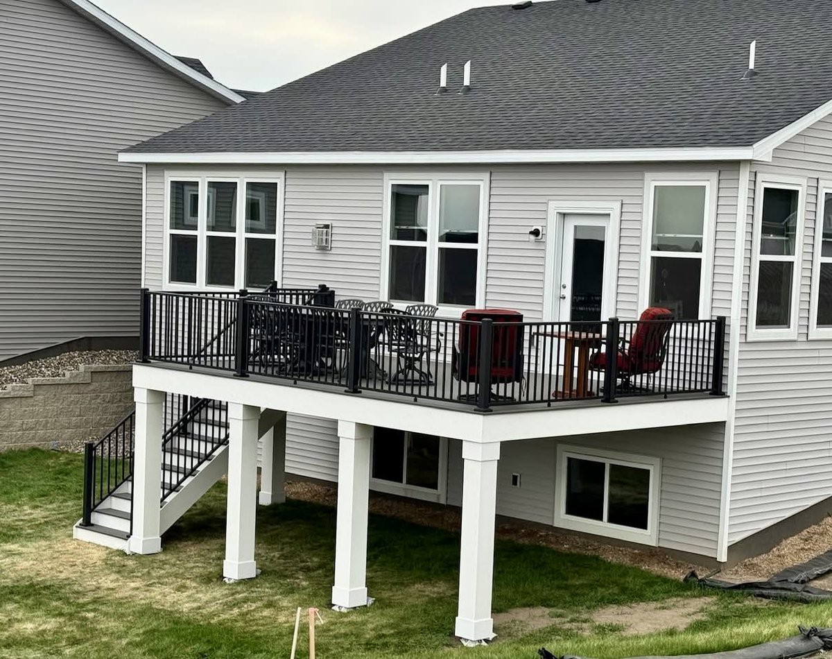 Deckorators Driftwood Decking and Westbury Tuscany Aluminum Railing.  White PVC post wraps add a nice finishing touch.