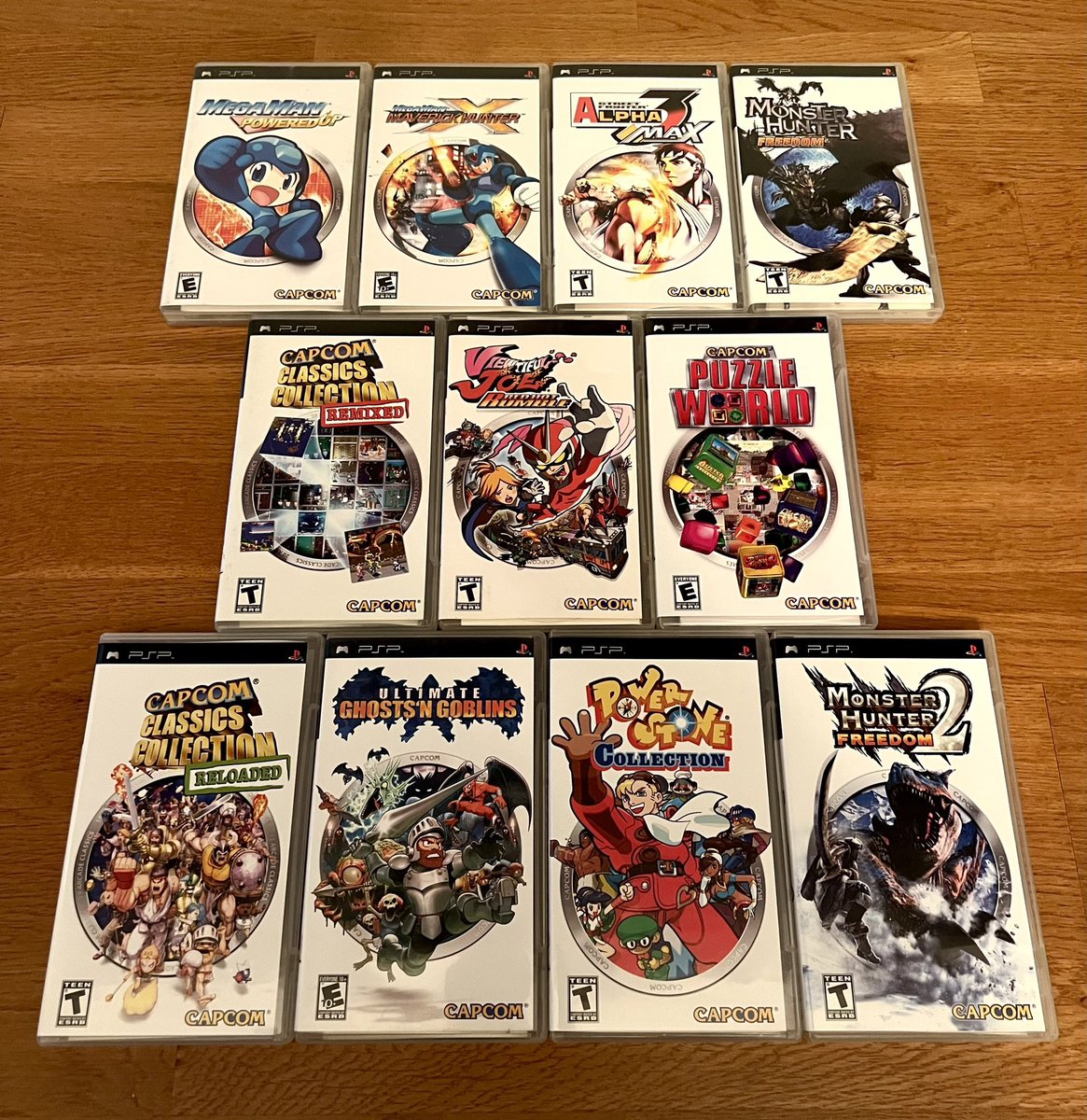 JoshuaMFrench's tweet photo. In 2006-2007 Capcom branded PSP releases with similar covers and even spine art that lined up (with the exception of MHF2). This phase yielded some of the handheld’s most essential and perfectly optimized games, many of which haven’t been topped in nearly 2 decades. #PSPWednesday https://t.co/mqC54mpTqw