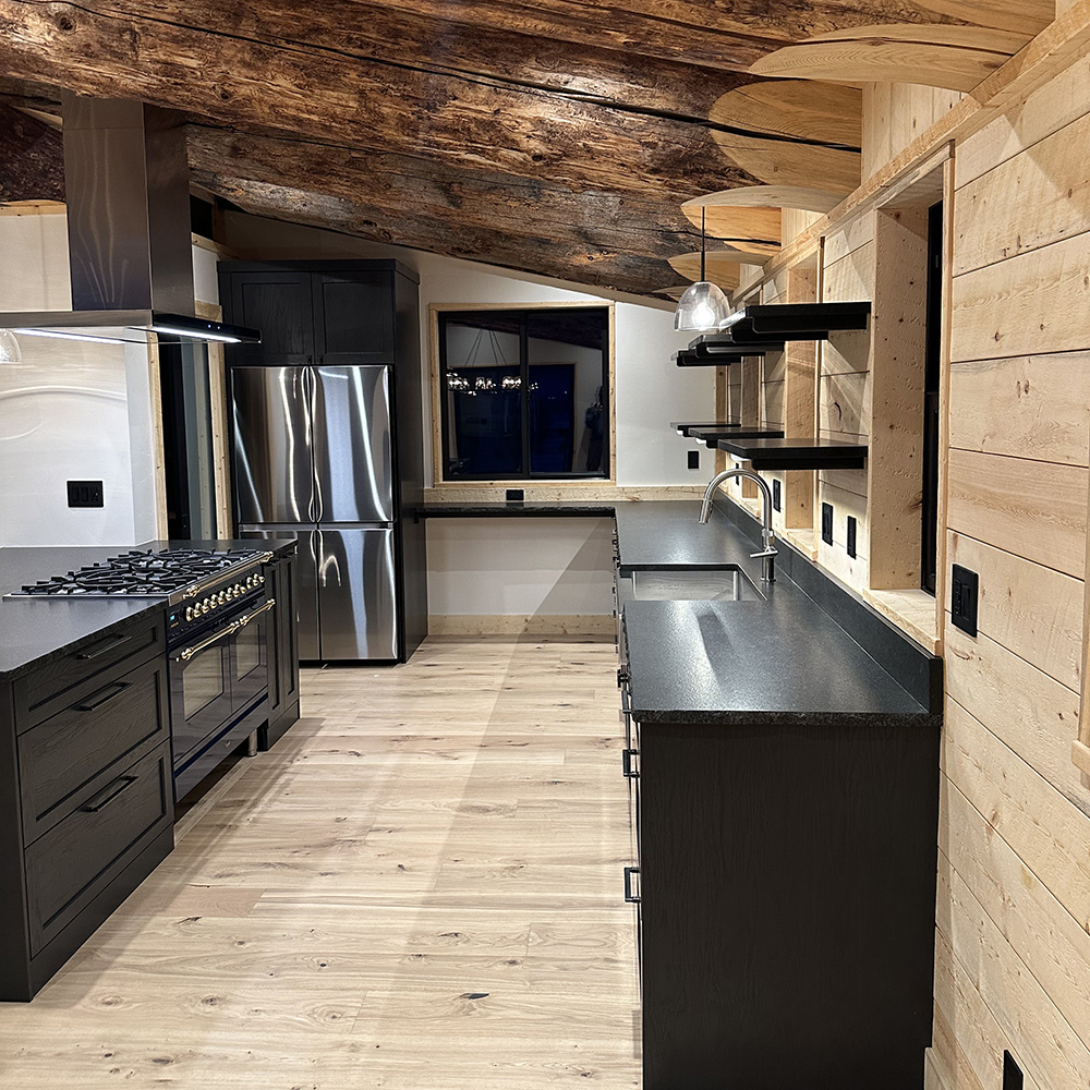 Black cabinetry and countertops come together seamlessly to create a striking monochromatic look in this beautiful cabin kitchen.

#ThomasvilleCabinetry #KitchenDesign #KitchenInspo #DreamKitchen #ModernKitchen #HomeDecor #KitchenOrganization #KitchenStyle