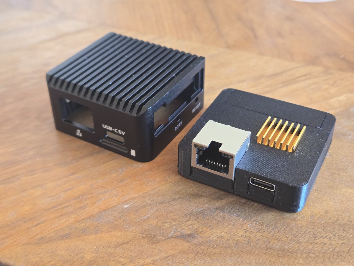 tynan's tweet image. I think this is one of the coolest things I've designed and 3D printed. It's a powerful portable router but the included case on the left was huge. I removed the USB A port and made a much smaller case which could reuse the wifi antennae and the original screws.