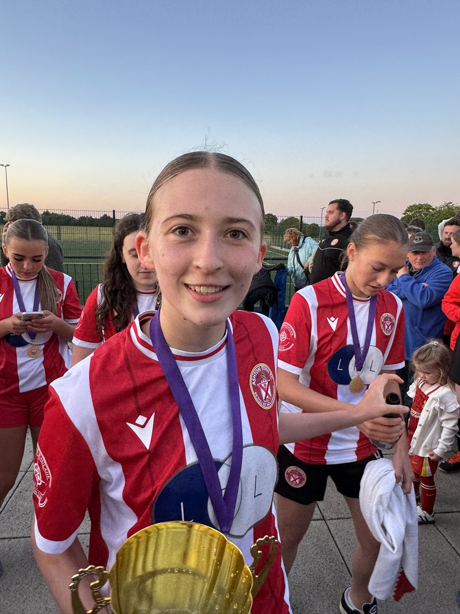 ashtonladies_'s tweet photo. Ladies &amp; gentlemen, we give you the @LiverpoolWYFL League Cup champions 2025! 

That’s a League &amp; Cup double in our very first season at open age! 🏆🏆

#MadeInAshton ❤️🤍 https://t.co/r9GxlzXMNs